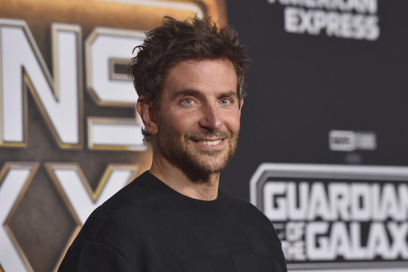 Bradley Cooper in a black t-shirt posing at the red carpet for "Guardians of the Galaxy Vol. 3"