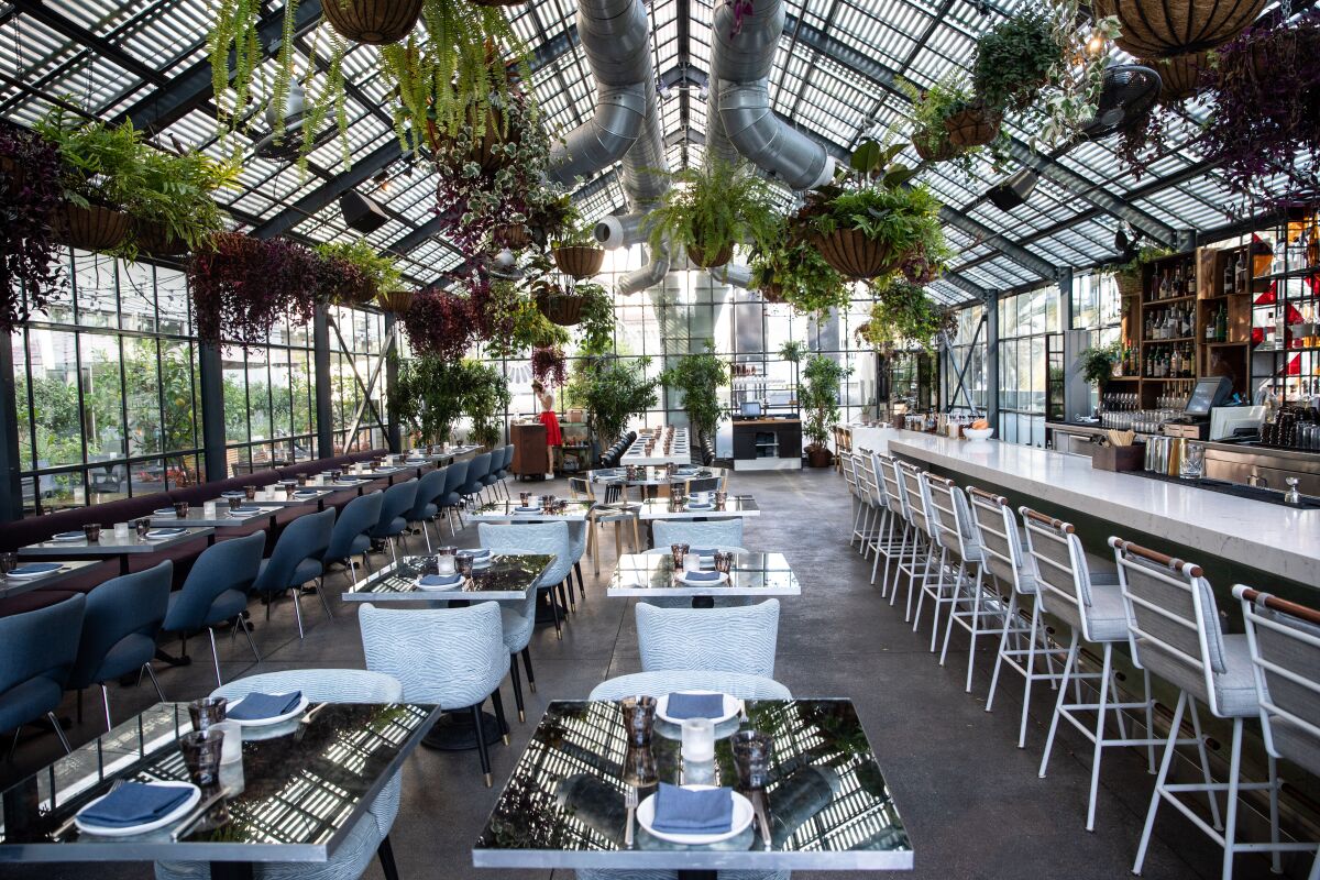 Restaurant with a greenhouse-style roof and walls