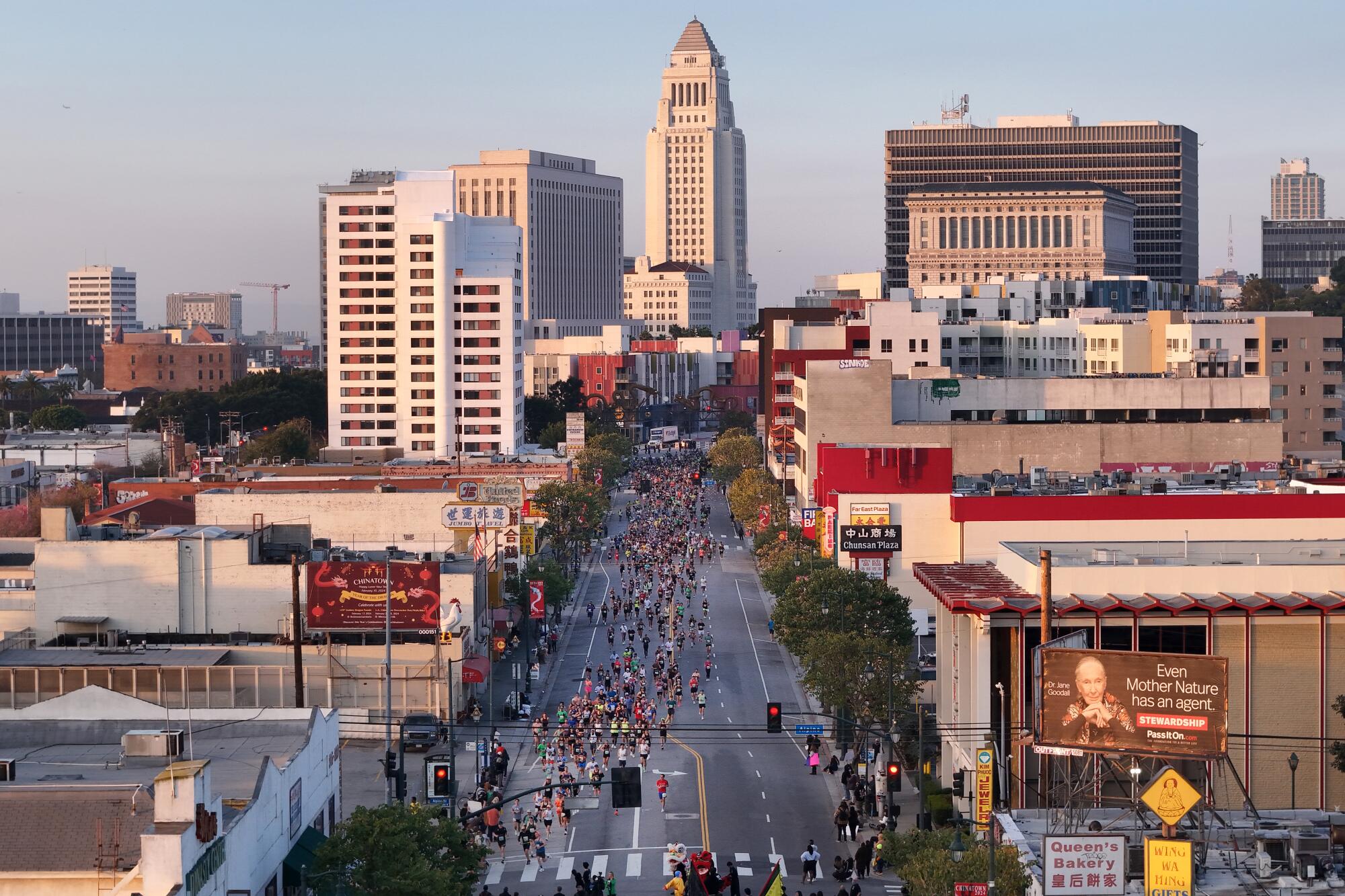 The LA Marathon makes its way onto Broadway in Chinatown at the two-mile mark on Sunday.