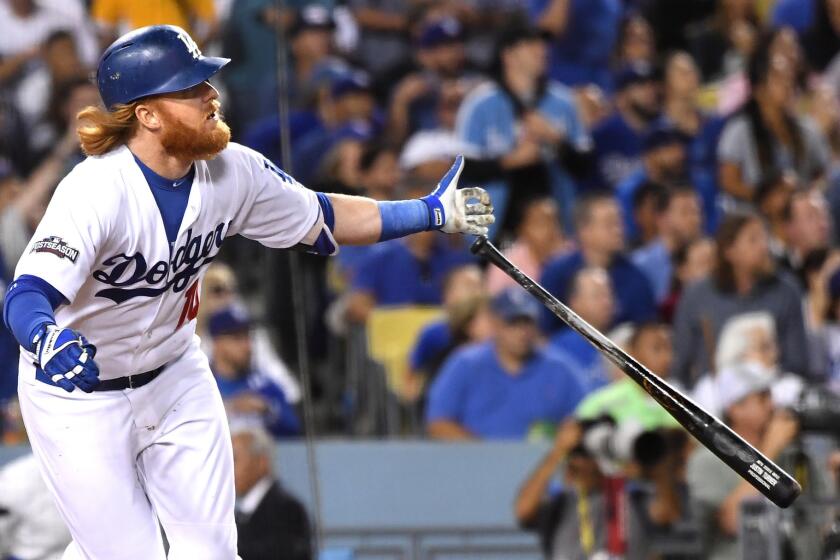 Justin Turner hits a home run during Game 3 of the NLCS.