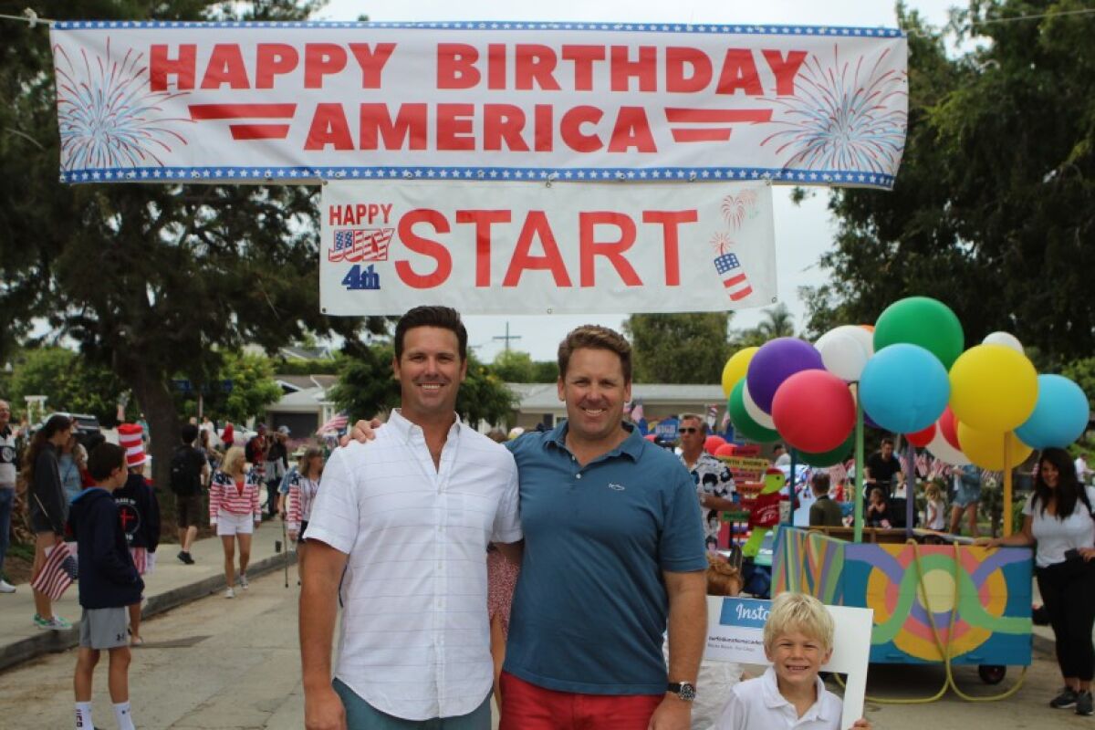 Russ and Scott Murfey, organizers of the Bird Rock Fourth of July community parade, get ready for the start in 2019.