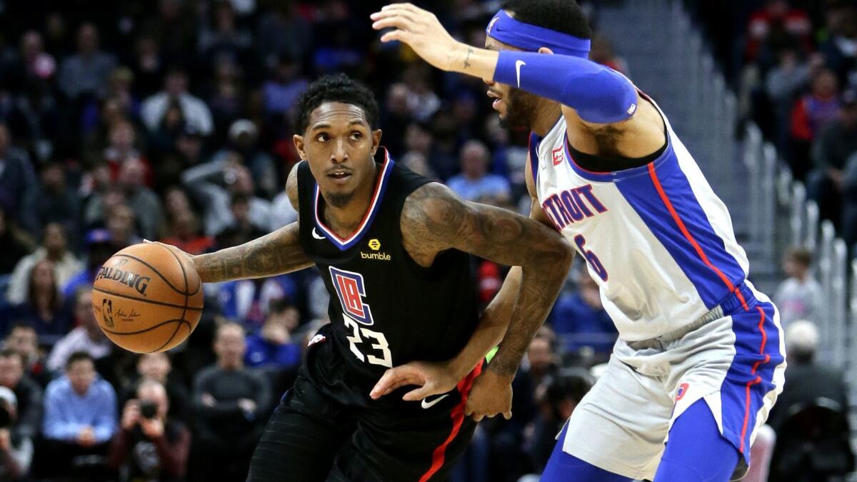 Clippers guard Lou Williams drives against Pistons guard Bruce Brown during the second half Saturday.