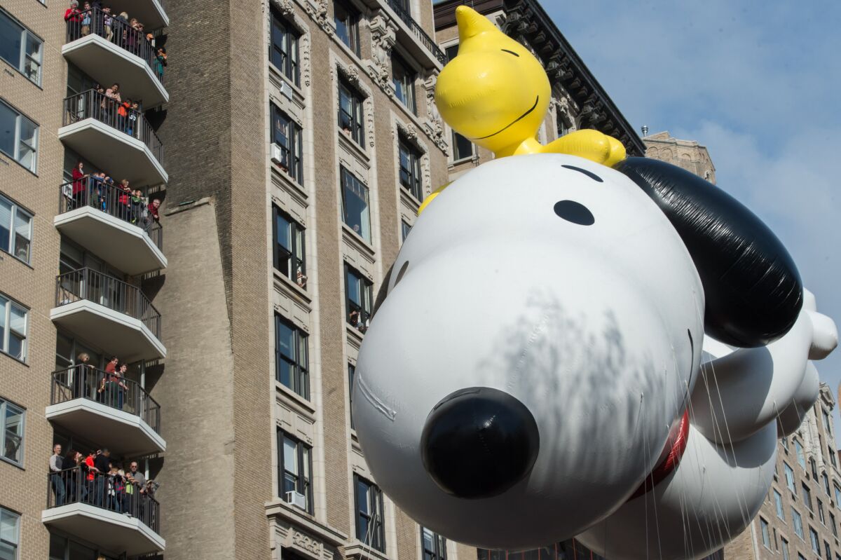 Snoopy balloon with Woodstock at the Macy's Thanksgiving Day Parade