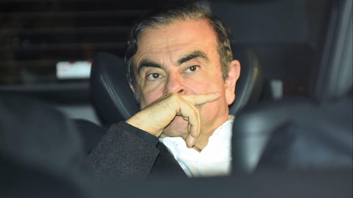 Former Nissan Chairman Carlos Ghosn leaves his lawyers' offices in Tokyo on March 6 after being released on bail from a detention center.