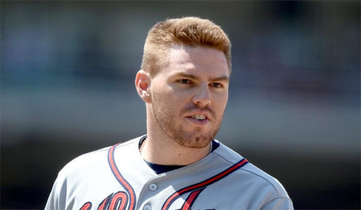 Braves first baseman Freddie Freeman will stay in Atlanta this week to receive treatment for his sore elbow.