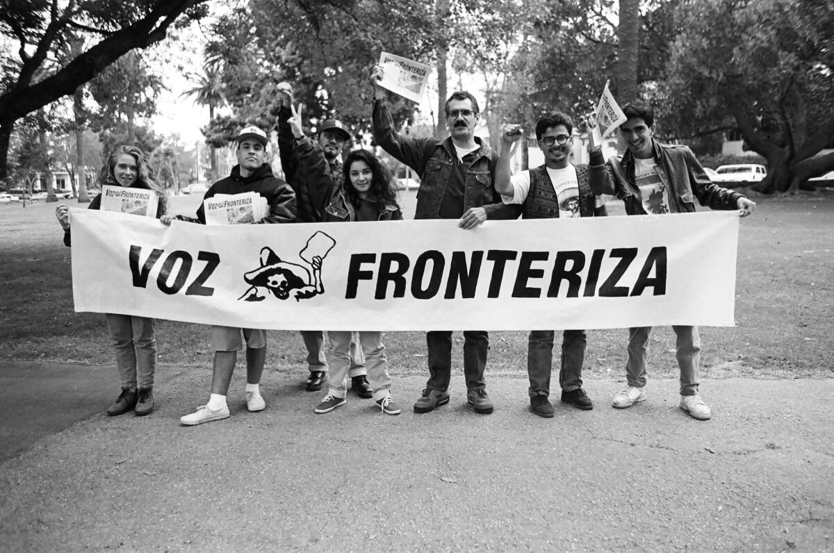 Caption: Adolfo Guzman-Lopez (center with vest) and other UC San Diego students attend a protest  
