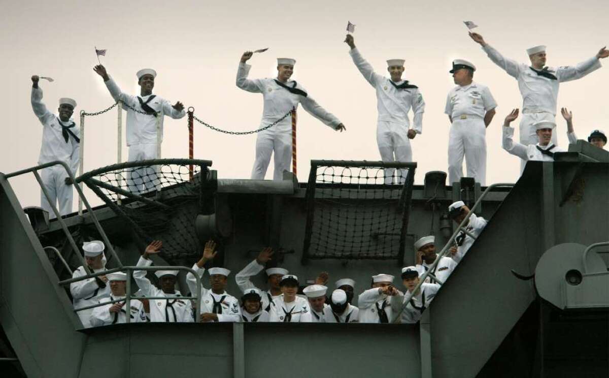Sailors of the aircraft carrier Harry S. Truman wave on their return to Norfolk, Va., in 2003. The Truman battle was scheduled to return to the Persian Gulf this month but stayed home because of the federal budget sequester.