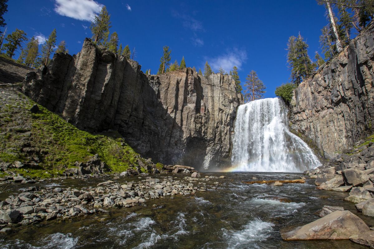Water cascades down Rainbow Falls National Monument near Red's Meadow.