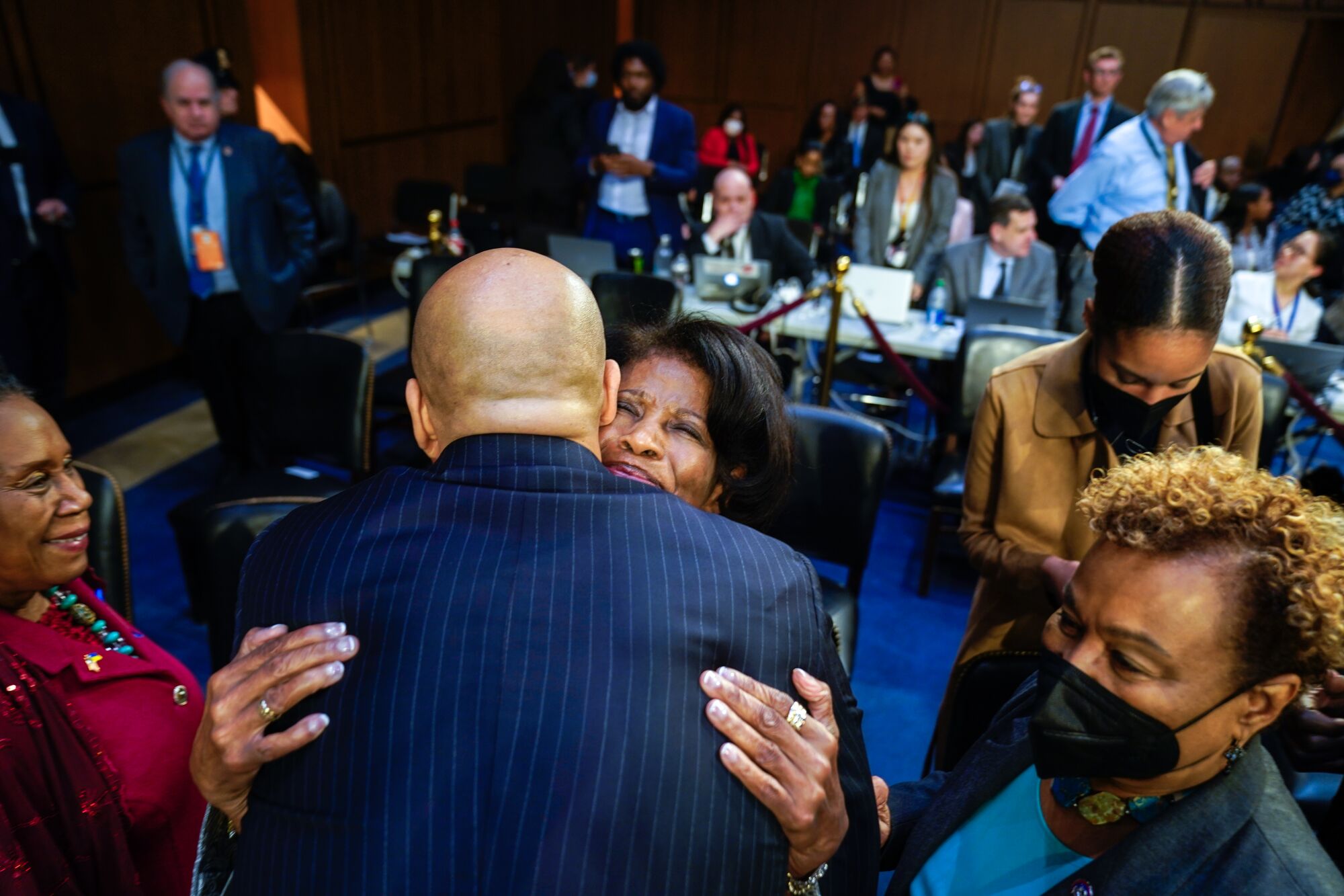 Senator Cory Booker hugs Ellery Brown, Judge Jackson's mom.
