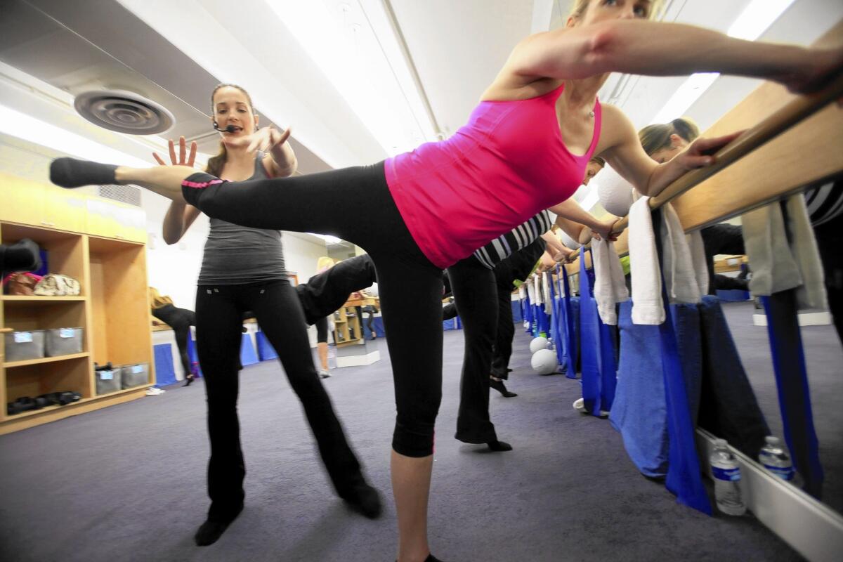 Sarah Pfeifer leads a class with ballet- and Pilates-type moves at Physique 57.