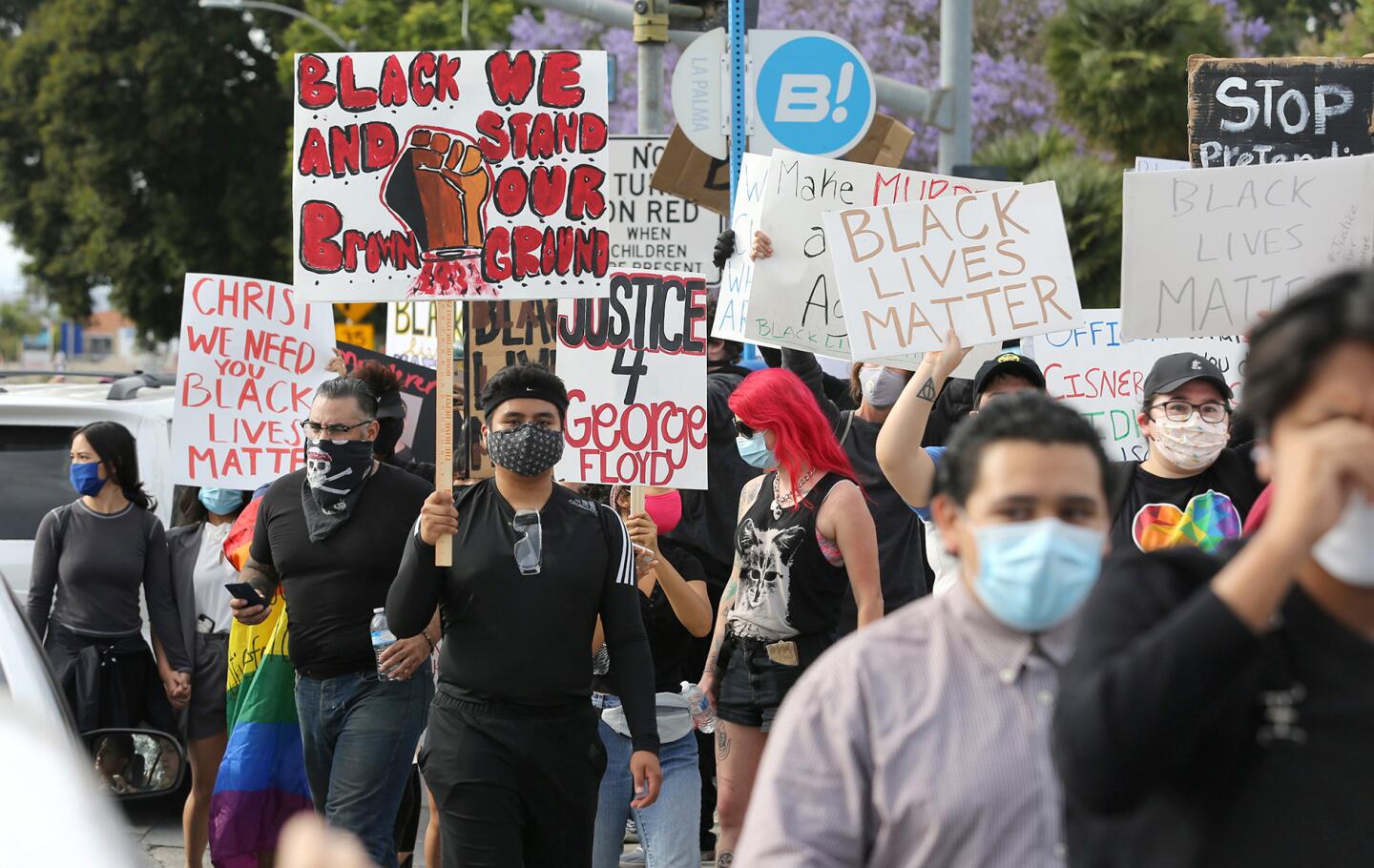 Peaceful and vocal demonstrators begin to march down Harbor Blvd during Black Lives Matter protest in Anaheim on Monday.