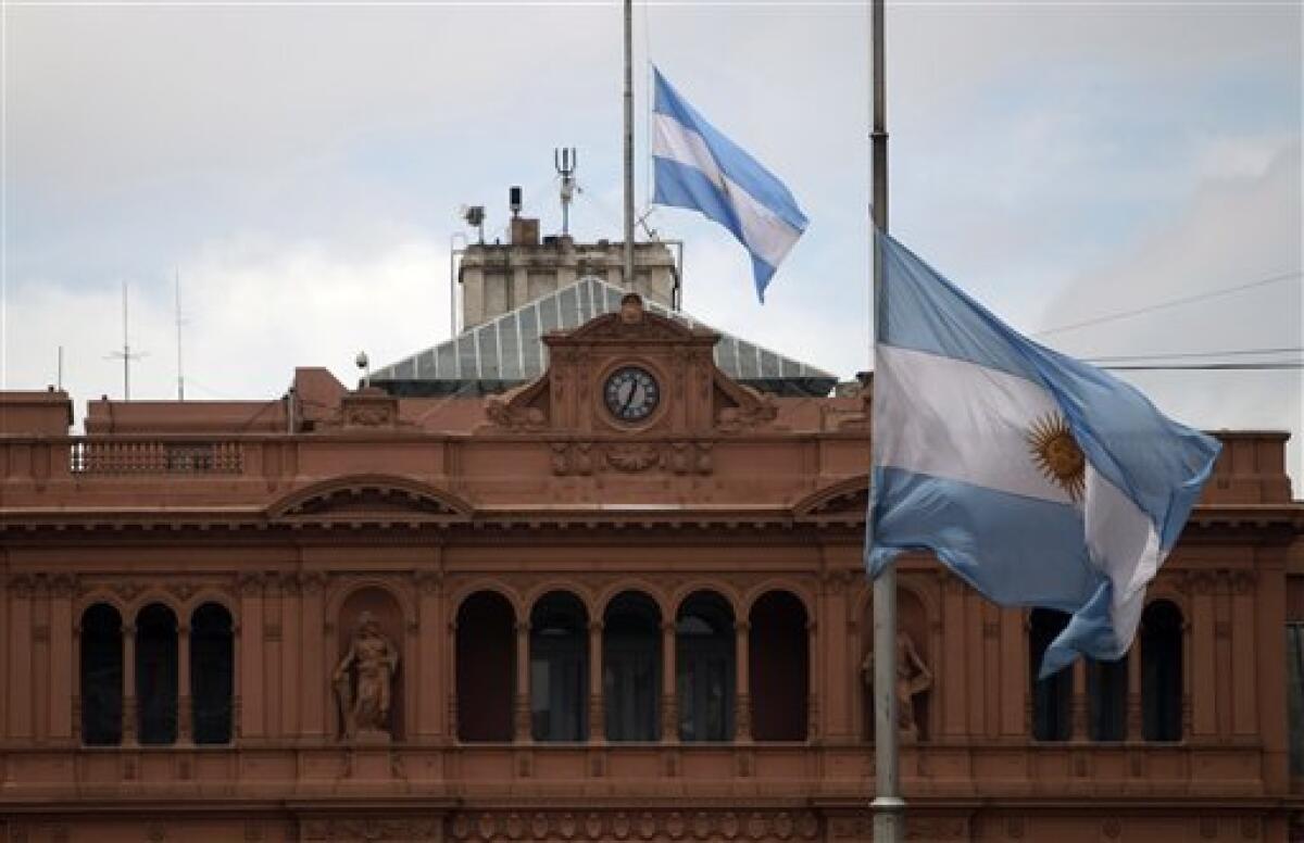 Argentine flags fly at half mast outside the government palace in Buenos Aires, Argentina, Wednesday Oct. 27, 2010. Argentina's former President Nestor Kirchner, who served as president from 2003-2007, died Wednesday after suffering heart attacks at age 60. (AP Photo/Natacha Pisarenko)