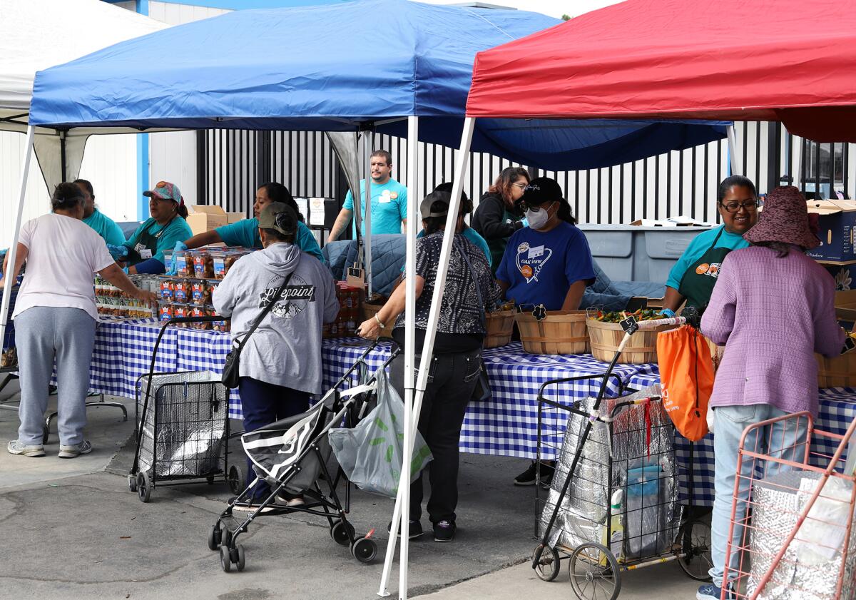 Oak View community members visit the Second Harvest Food Bank's Mobile School Pantry in Huntington Beach