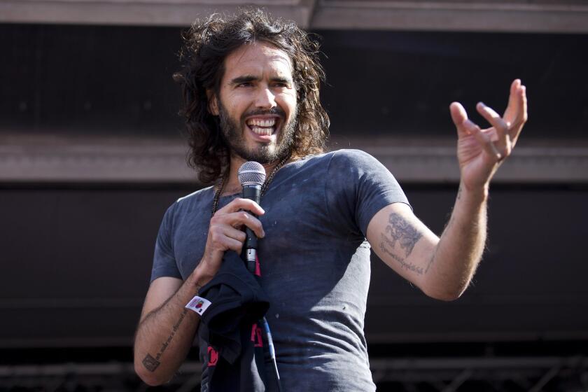 Director Ondi Timoner had a difficult time making a documentary about Russell Brand, seen here at an anti-austerity rally in Parliament Square in London.
