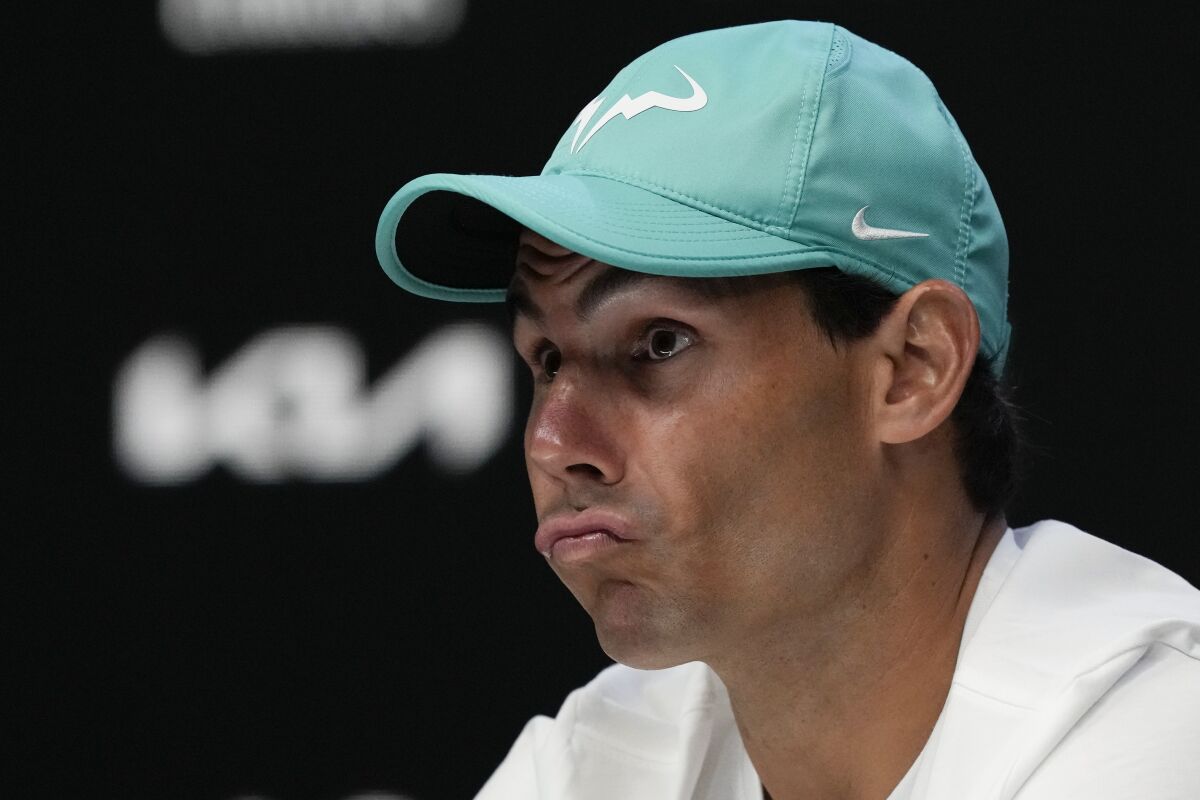 Spain's Rafael Nadal reacts during a press conference ahead of the Australian Open tennis championships in Melbourne, Australia, Saturday, Jan. 15, 2022. (AP Photo/Simon Baker)