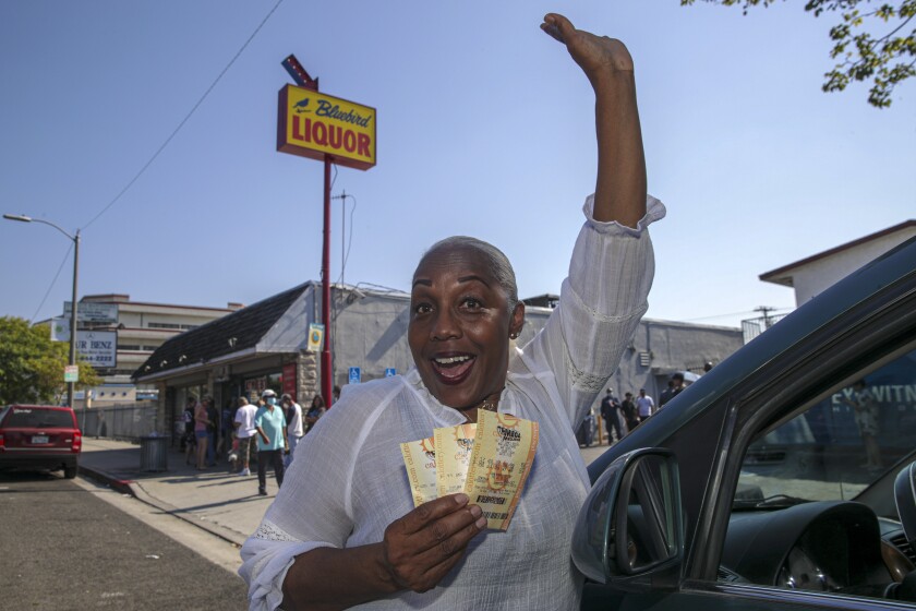 Cindy McAdoo-Stewart drove from Lancaster to buy her Mega Millions lottery tickets at Bluebird Liquor in Hawthorne.