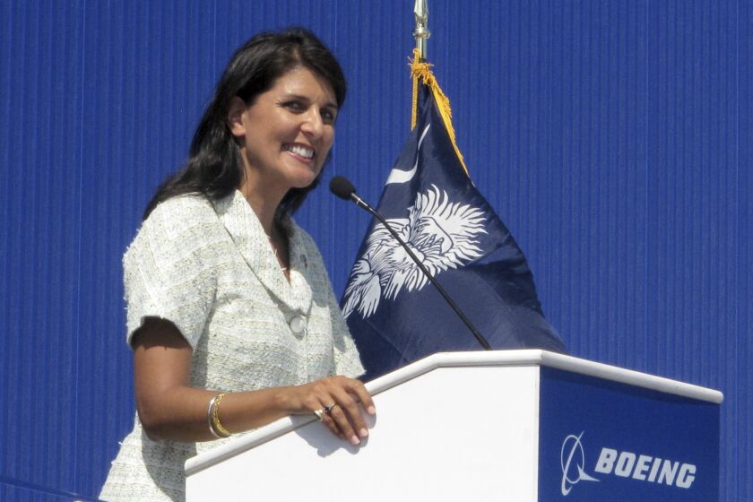 In this June 10, 2011 file photo former South Carolina Gov. Nikki Haley speaks during the dedication of Boeing Co.'s $750 million final assembly plant in North Charleston, S.C. Haley has resigned, Thursday, March 19, 2020, from the board of Boeing Co., cutting ties with a company she long supported as South Carolina governor because of her opposition to a bailout of the airplane manufacturer that is in the works amid the growing coronavirus outbreak. (AP Photo/Bruce Smith, file)