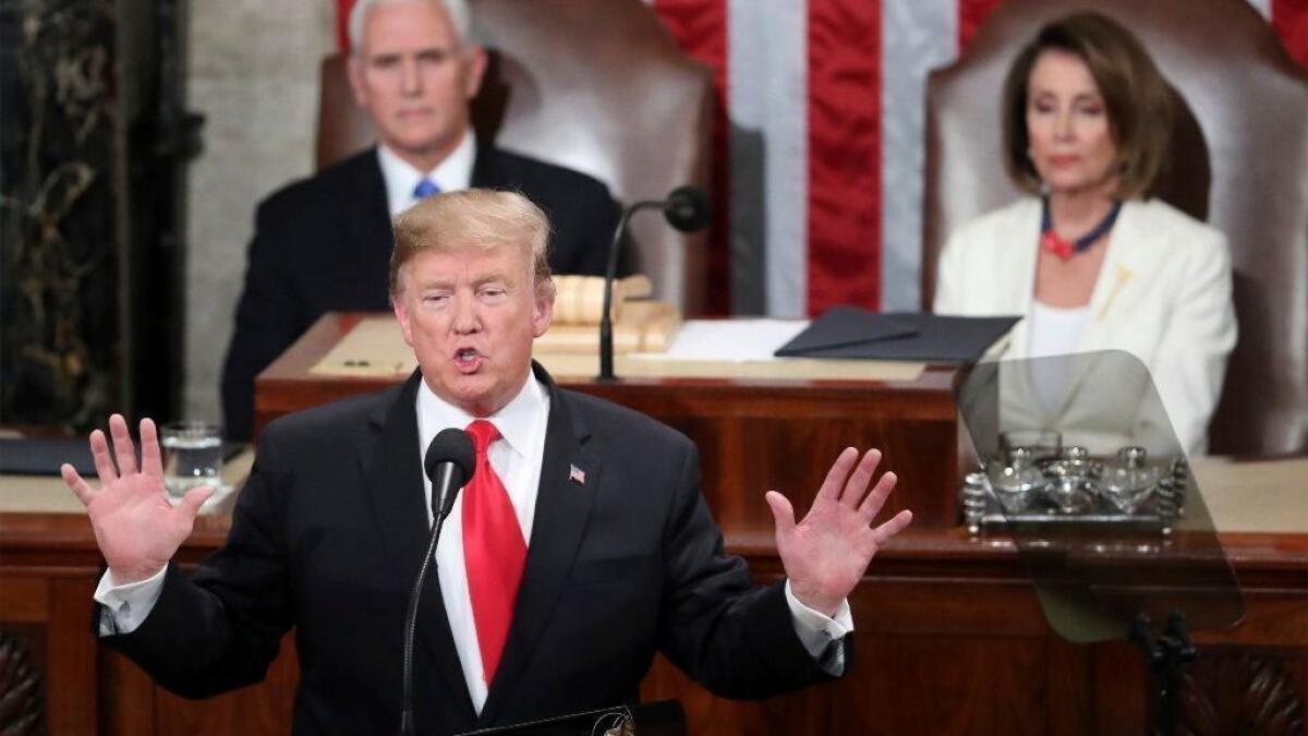 President Trump delivers his State of the Union address to a joint session of Congress as Vice President Mike Pence, left, and Speaker of the House Nancy Pelosi (D-San Francisco) watch. With potential new government shutdown looming, Trump blames Democrats.