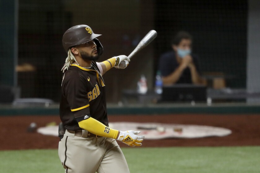 San Diego Padres shortstop Fernando Tatis Jr. watches the flight of his grand slam.