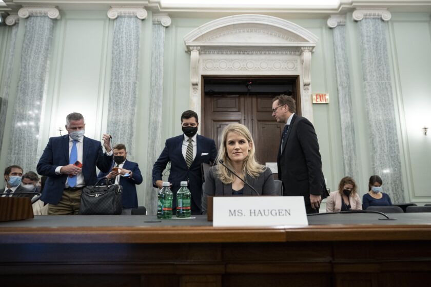 Former Facebook employee and whistleblower Frances Haugen prepares to leave after a Senate Committee on Commerce, Science, and Transportation hearing on Capitol Hill on Tuesday, Oct. 5, 2021, in Washington. (Drew Angerer/Pool via AP)