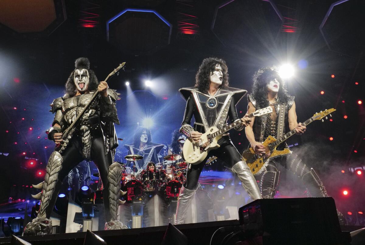 Gene Simmons, Tommy Thayer and Paul Stanley of KISS perform in full makeup.