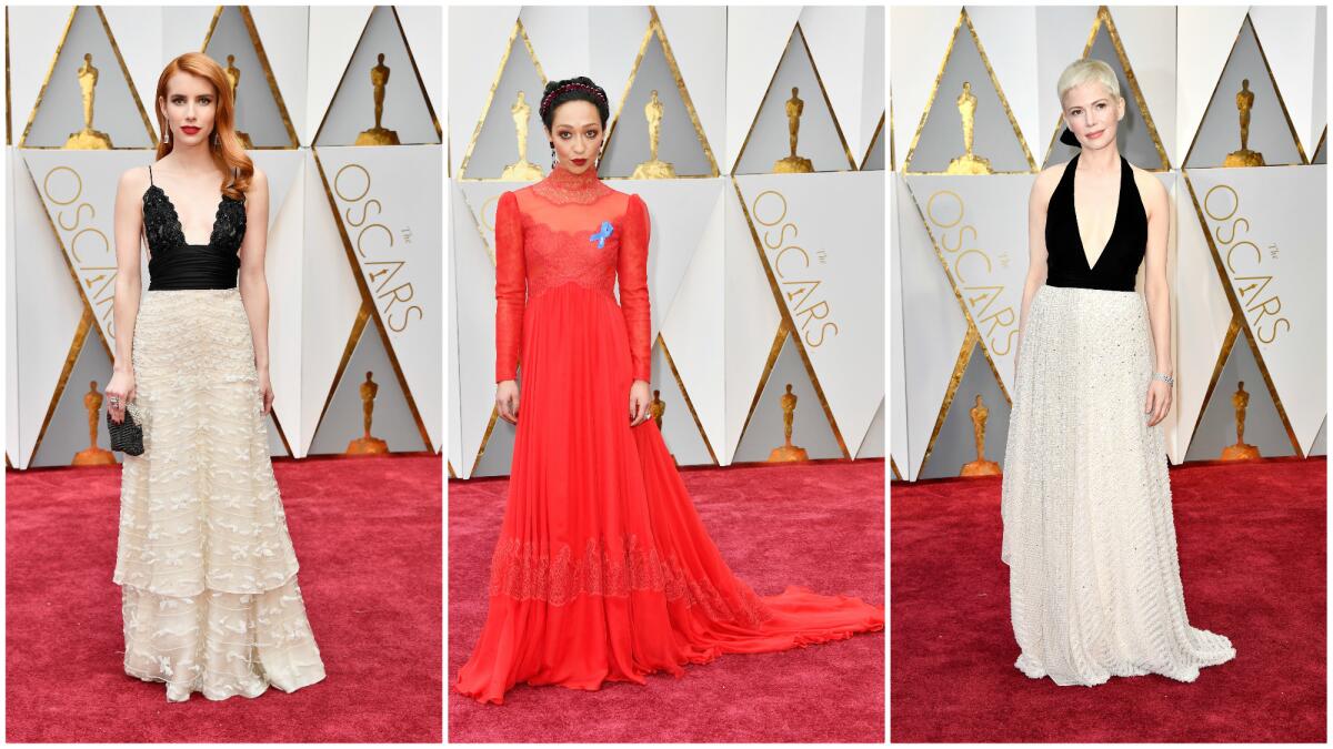 Emma Roberts in a 12-year-old Armani Privé dress, left, Ruth Negga goes "pagan goddess" in custom Valentino, center, and Michelle Williams mines Old Hollywood glamour in Louis Vuitton, right.
