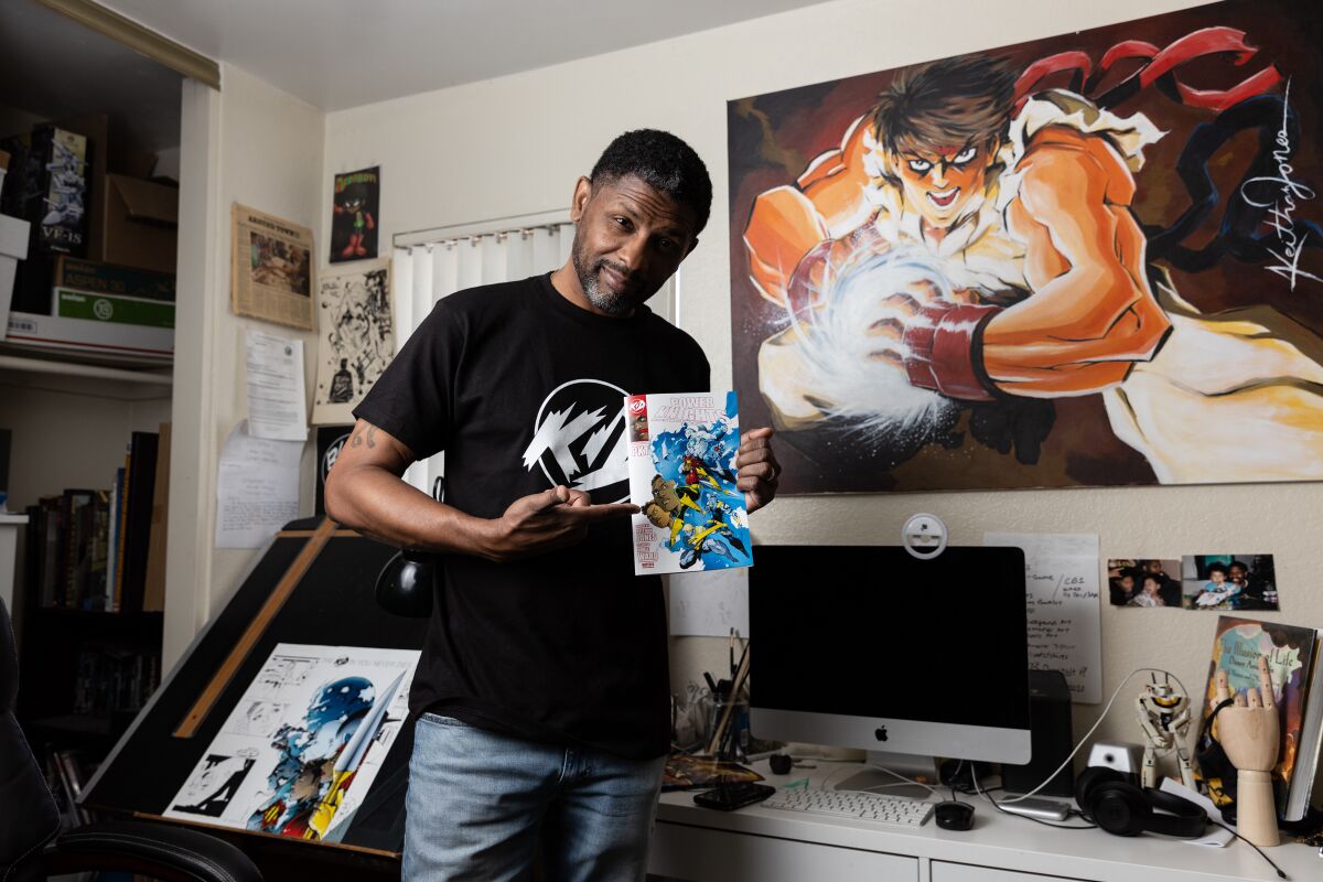 Keithan Jones, comic book artist and founder of KID Comics, inside his home at El Cajon on Wednesday, July 13, 2022.