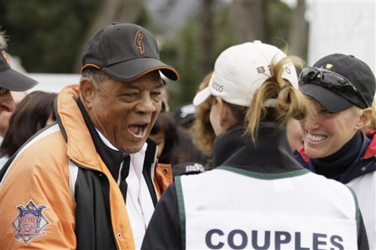 Baseball Hall of Famer Willie Mays, left, laughs on the first tee with Midge Trammell, center, a caddie for Fred Couples, as caddie Brenda Calcavecchia, right, caddie for Mark Calcavecchia, looks on during the third round of the Charles Schwab Cup Championship golf tournament in San Francisco, Saturday, Nov. 5, 2011.