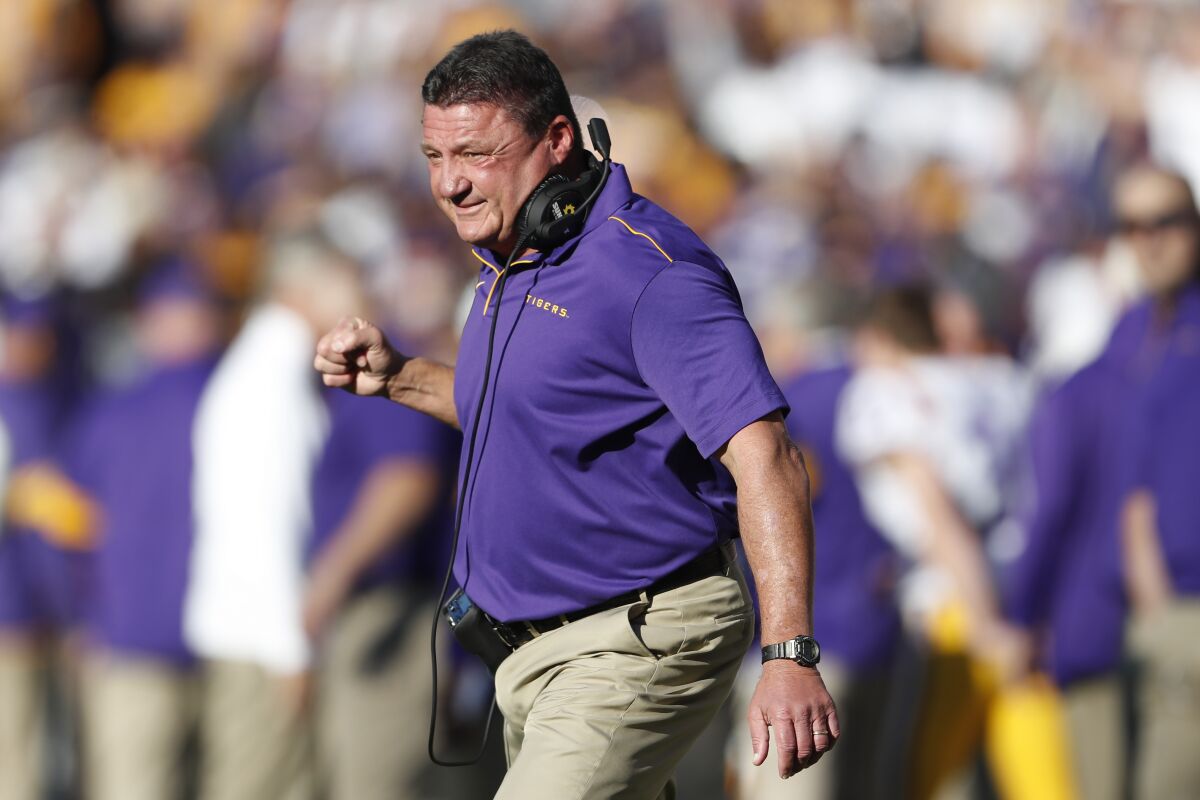 LSU coach Ed Orgeron reacts after the Tigers scored a touchdown against Alabama during a game on Nov. 9, 2019, in Tuscaloosa.
