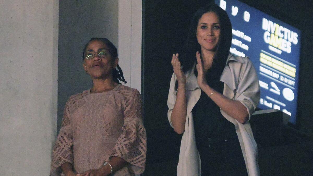 Meghan Markle, right, watches the closing ceremonies of the Invictus Games with her mother, Doria Ragland in Toronto, on Sept. 30, 2017.