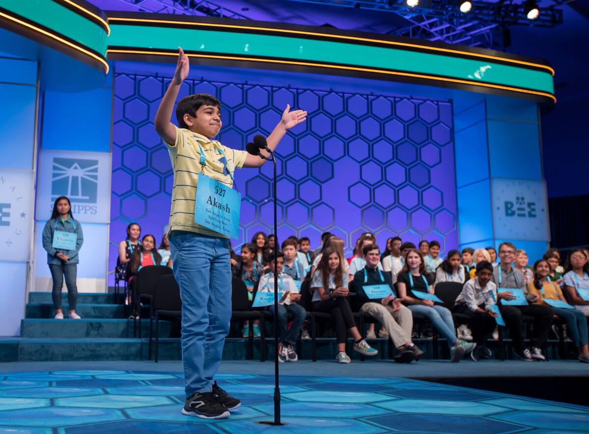 Akash Vukoti of San Angelo, Texas, reacts after correctly spelling "quota" during the third round of the 2019 Scripps National Spelling Bee in Oxon Hill, Md., on May 29.