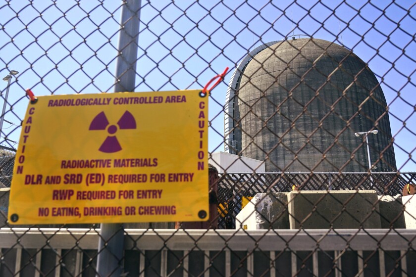 A warning sign on a fence at a nuclear reactor containment building at Indian Point Energy Center in New York.
