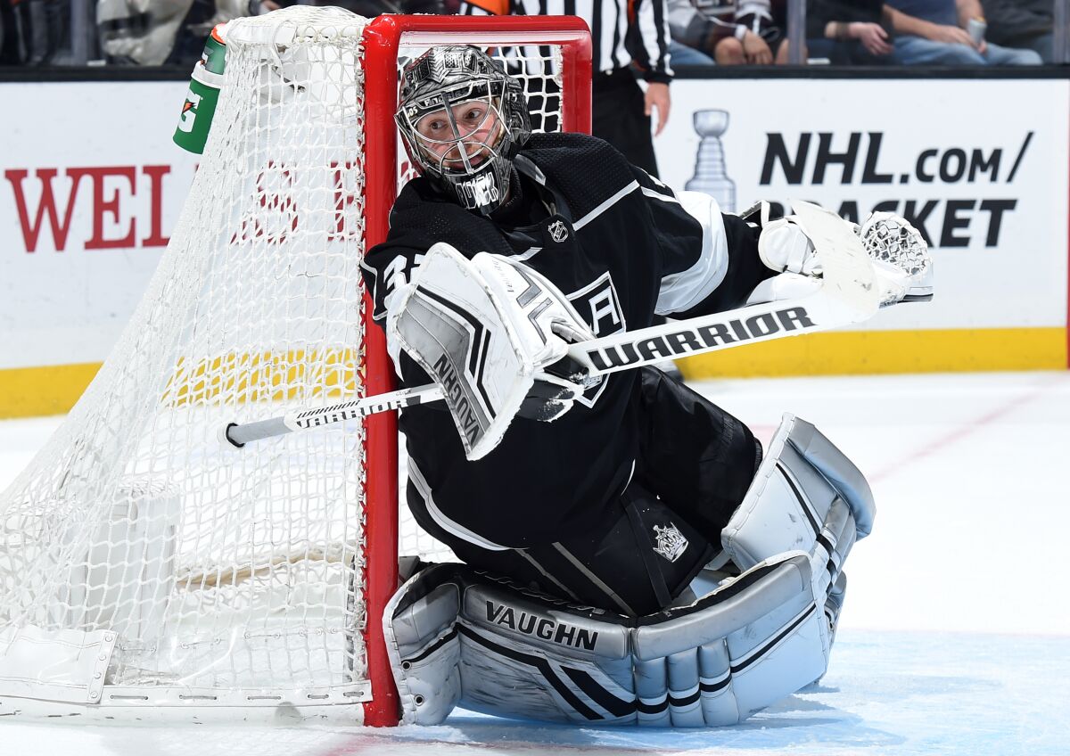 Kings goaltender Jonathan Quick keeps his eyes on the puck during a game against the Calgary Flames in April.