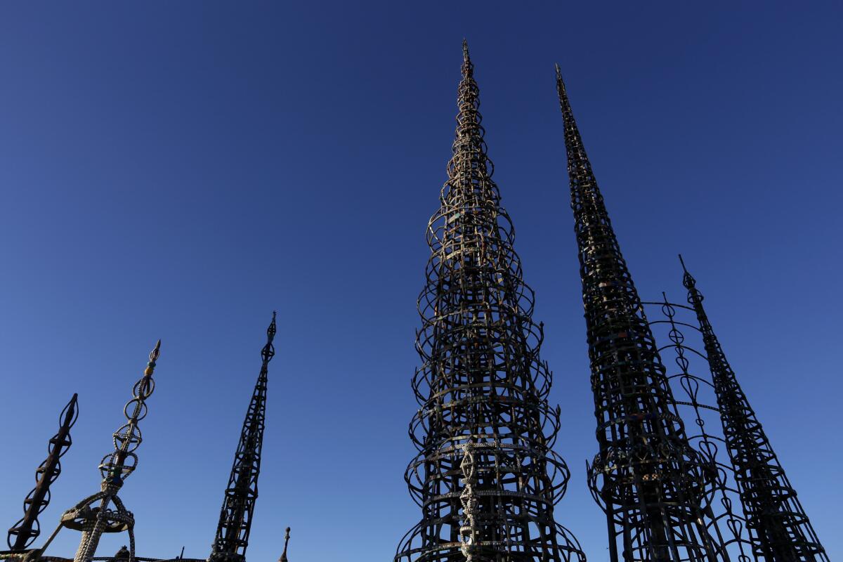 The 50th anniversary of the Watts riots has inspired an interesting look at the place of Watts in our culture. Seen here: The Watts Towers at dusk.
