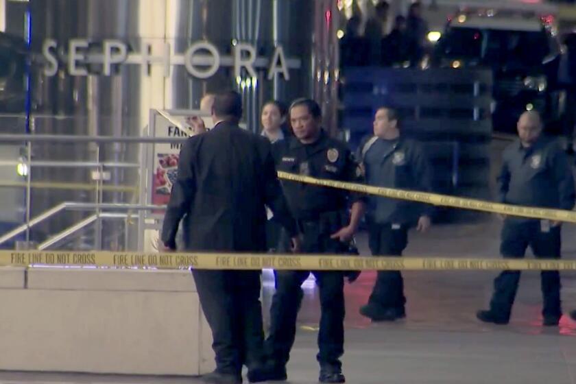 An investigation is underway after a security guard fatally shot a man suspected of stabbing a 9-year-old boy and a 25-year-old woman Tuesday evening, Nov. 15, 2022, at a Target store in downtown Los Angeles, police said.