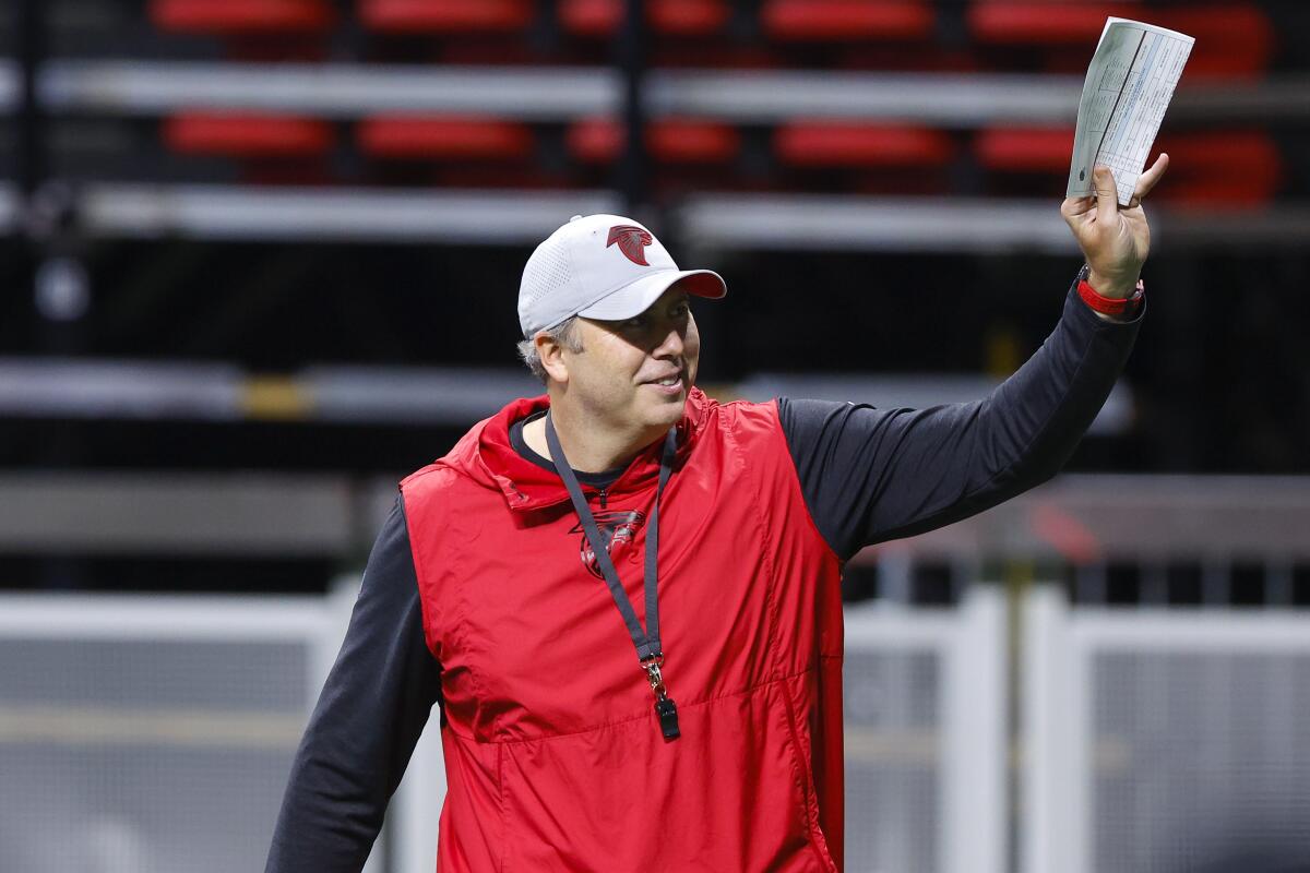 Atlanta Falcons coach Arthur Smith waves to fans during the NFL football team's open practice in Atlanta on Monday, Aug. 15, 2022. (AP Photo/Todd Kirkland)