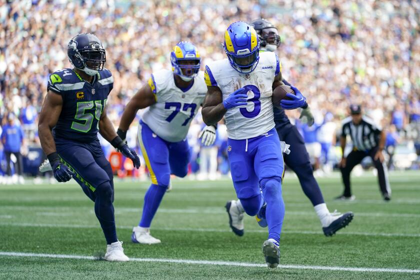 Rams running back Cam Akers scores against the Seattle Seahawks in their 2023 season opener.