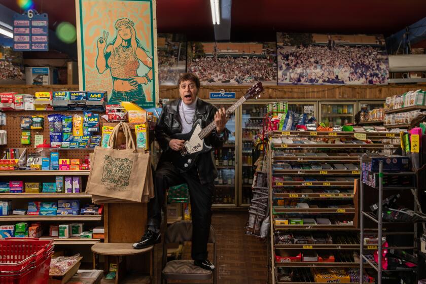 LOS ANGELES, CA-FEBRUARY 15, 2023:Tommy Bina is photographed inside the Canyon Country Store on Laurel Canyon Blvd. in Los Angeles, which he's owned since 1985. Bina has worked to keep the rock and roll spirit of Laurel Canyon alive through his store. (Mel Melcon / Los Angeles Times)