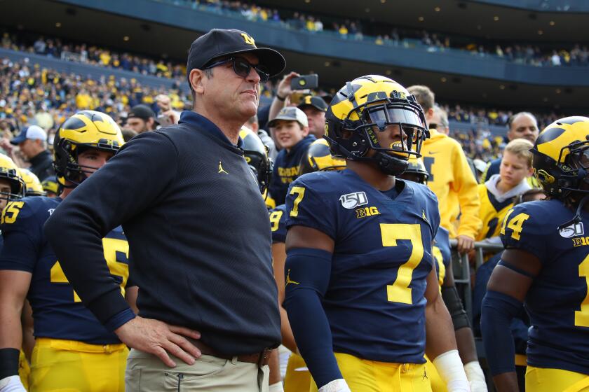ANN ARBOR, MICHIGAN - OCTOBER 05: Head coach Jim Harbaugh waits to take the field to play the Iowa Hawkeyes at Michigan Stadium on October 05, 2019 in Ann Arbor, Michigan. Michigan won the game 10-3. (Photo by Gregory Shamus/Getty Images)