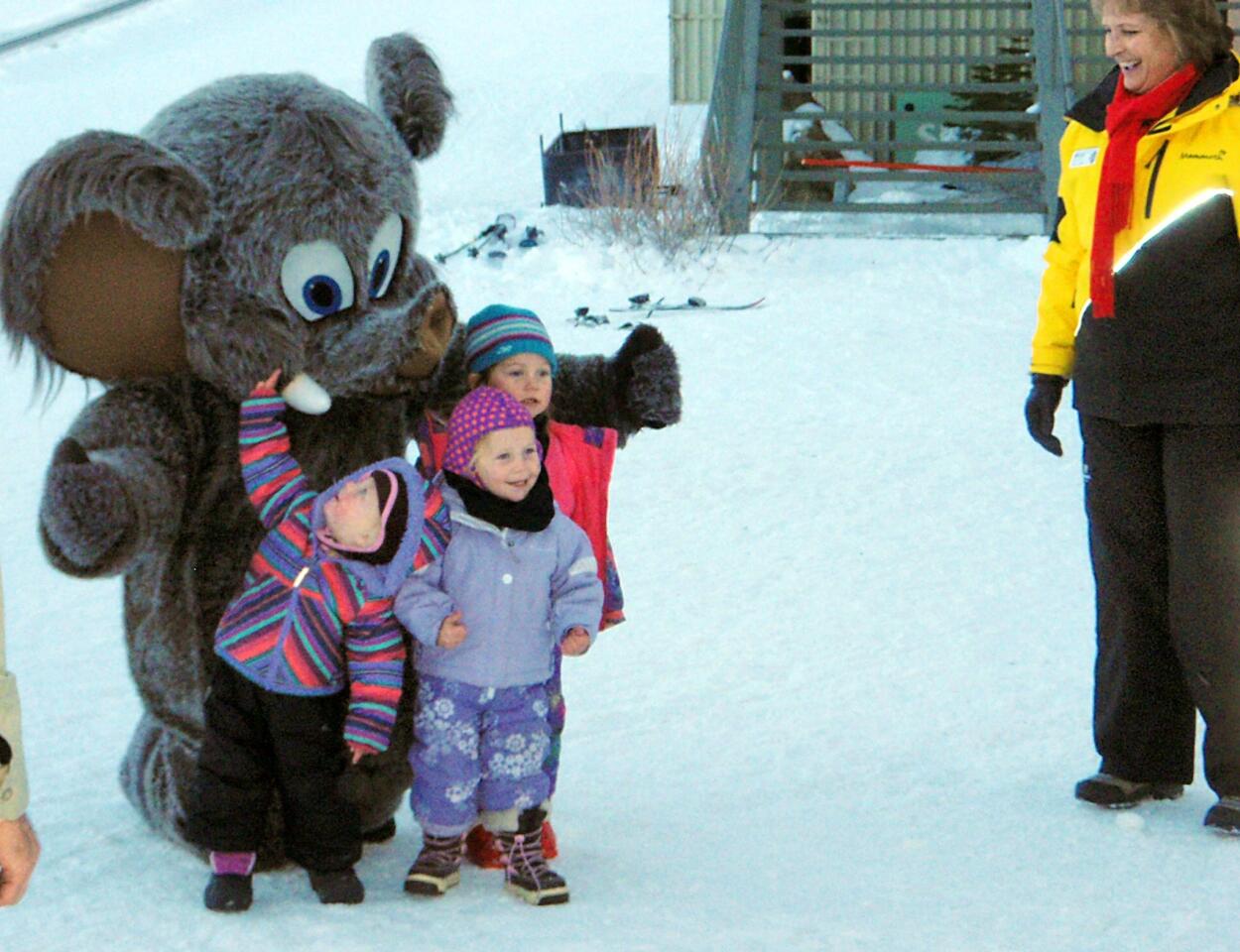 Kids meet the Mammoth mascot, Woolly. Mammoth owns and runs June Mountain.