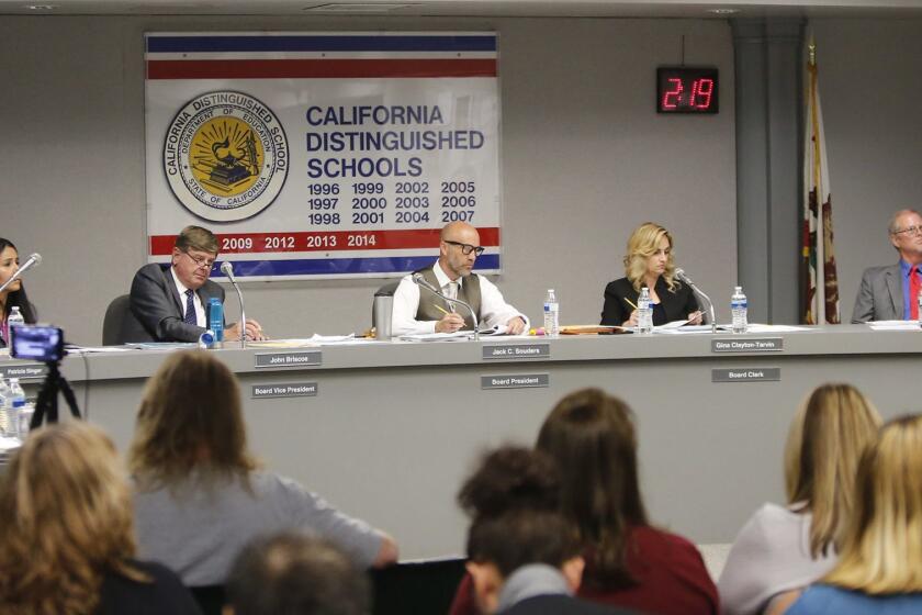 Ocean View School District board members Patricia Singer, president John Briscoe, Jack Souders, Gina Clayton-Tarvin, and Norm Westwell, from left, listen to public comments during meeting on Tuesday.