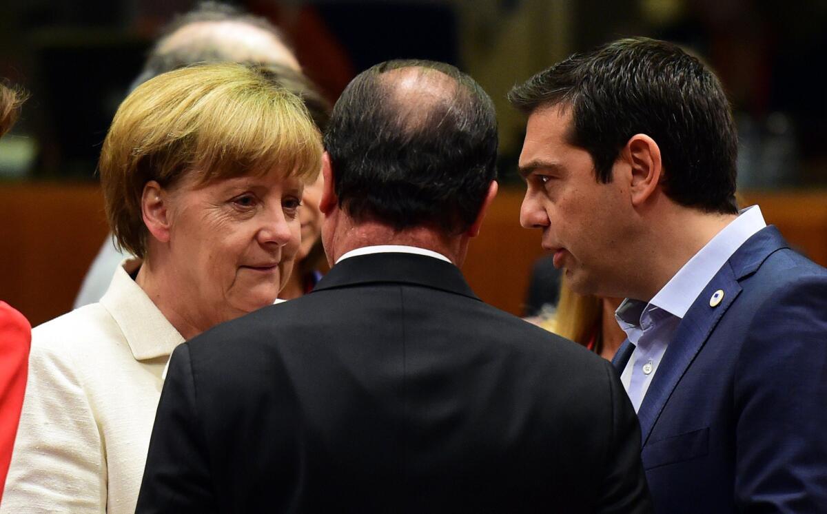 German Chancellor Angela Merkel, left, French President Francois Hollande, center, and Greek Prime Minister Alexis Tsipras confer prior to the start of a summit of Eurozone heads of state in Brussels.