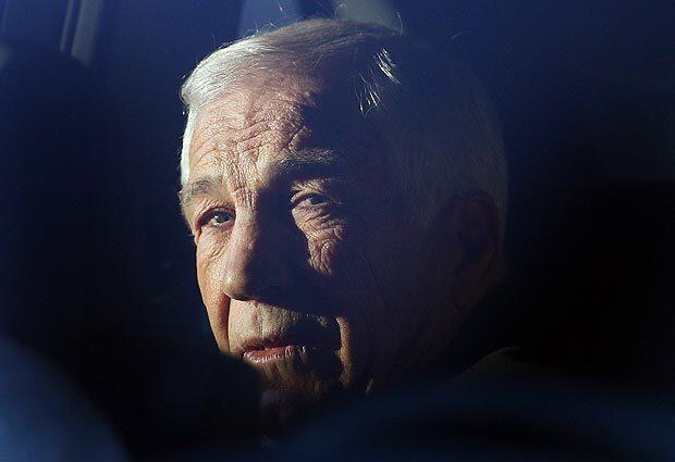 Former Penn State assistant football coach Jerry Sandusky sits in a car while leaving the Centre County Courthouse, on Tuesday in Bellefonte, Pa.