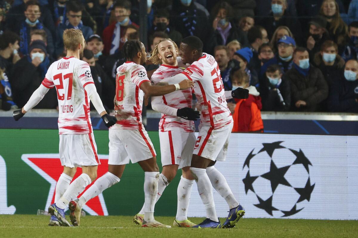 Leipzig's Emil Forsberg, second from right, celebrates with teammates after scoring during the Champions League Group A soccer match between Club Brugge and RB Leipzig at the Jan Breydel stadium in Bruges, Belgium, Wednesday, Nov. 24, 2021. (AP Photo/Olivier Matthys)