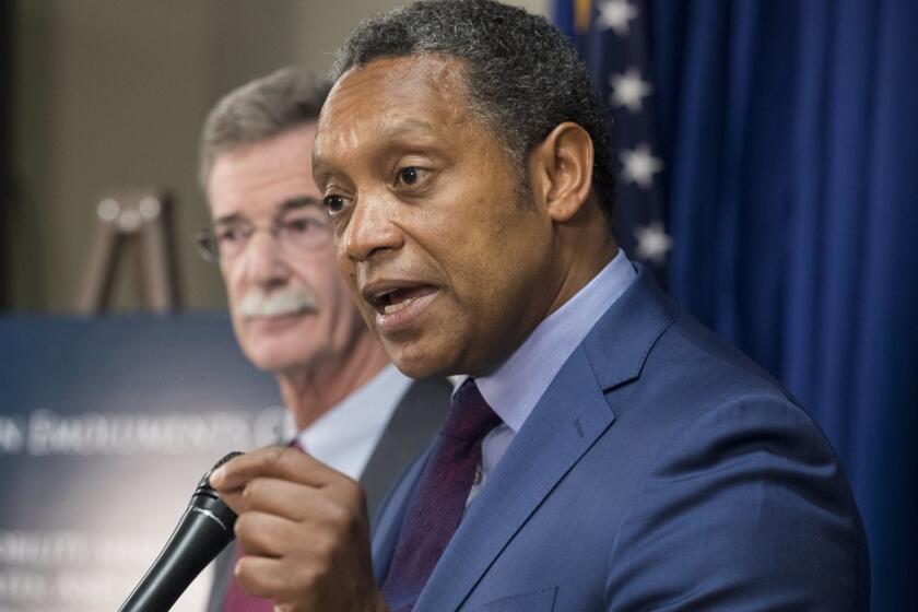 epa06024823 District of Columbia Attorney General Karl Racine (R) and Maryland Attorney General Brian Frosh (L) announce a lawsuit against US President Donald J. Trump, during a news conference in Washington, DC, USA, 12 June 2017. The lawsuit claims foreign payments to Trump's businesses violate the US Constitution's domestic emoluments clause. EPA/MICHAEL REYNOLDS ** Usable by LA, CT and MoD ONLY **