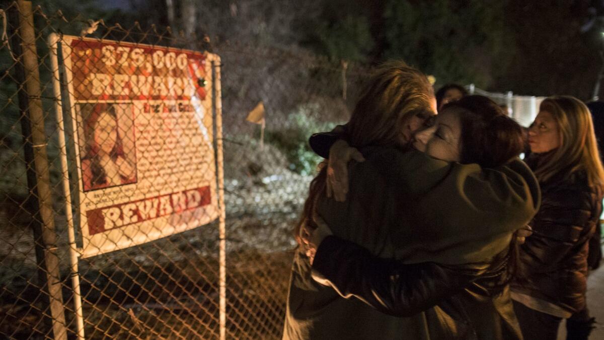 Darlene Guzman, right, hugs a friend during a vigil to remember her 22-year-old daughter Bree'Anna. (Brian van der Brug / Los Angeles Times)