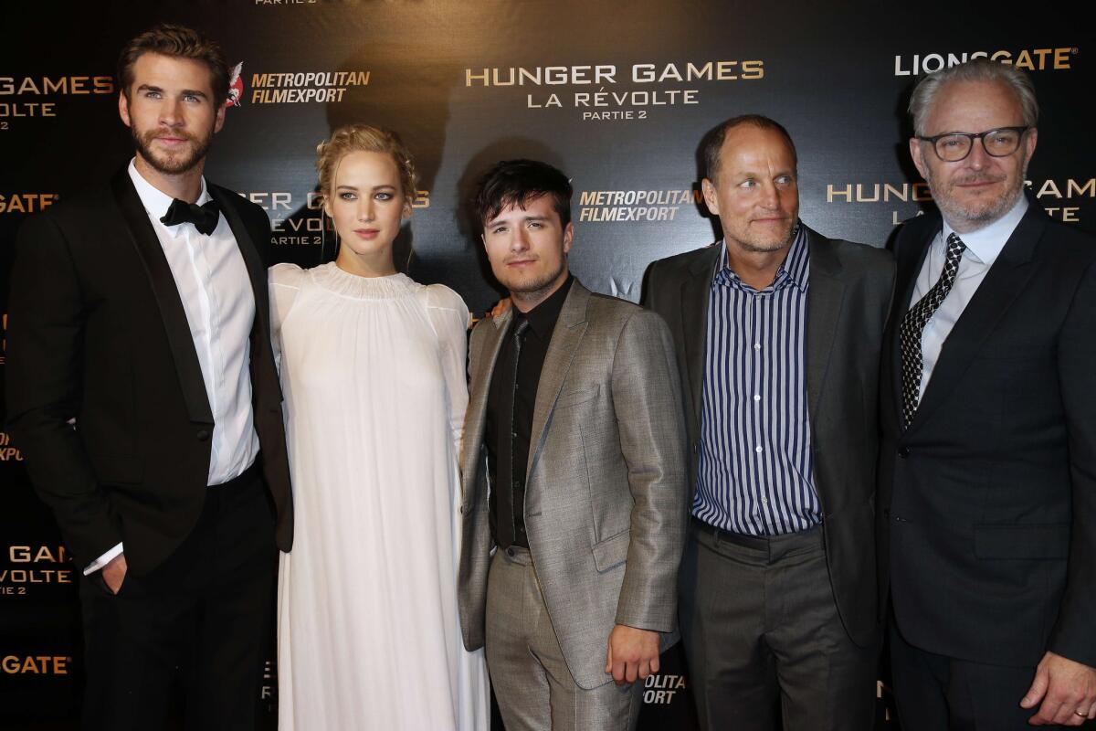 Liam Hemsworth, Jennifer Lawrence, Josh Hutcherson, Woody Harrelson and director Francis Lawrence pose during "The Hunger Games: Mockingjay - Part 2" photocall at the Grand Rex in Paris on Nov. 9, 2015.