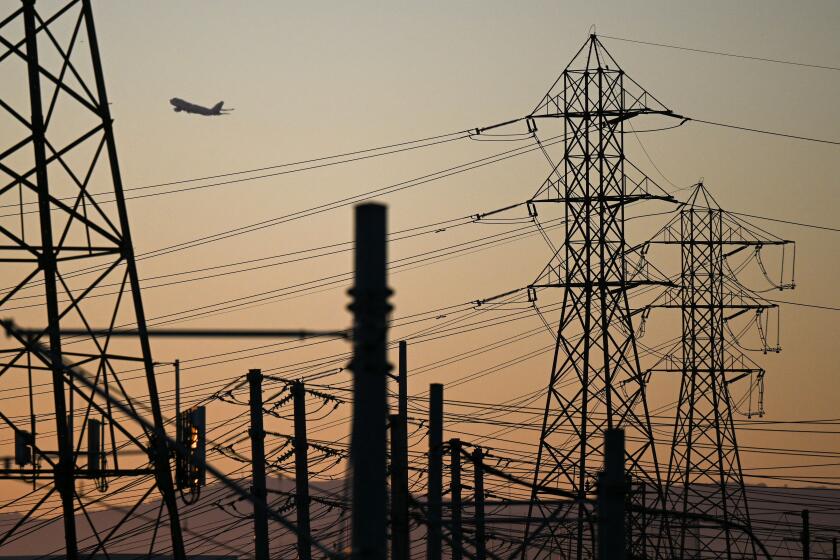 An aircraft takes off from Los Angeles International Airport (LAX) behind electric power lines at sunset as the California Independent System Operator announced a statewide electricity Flex Alert urging conservation to avoid blackouts in El Segundo, California on August 31, 2022. - Californians were told August 31, 2022 not to charge their electric vehicles during peak hours, just days after the state said it would stop selling gas-powered cars, as the aging electricity grid struggles with a fearsome heatwave. Temperatures as high as 112 degrees Fahrenheit (44 degrees Celsius) were forecast in some Los Angeles suburbs as a huge heat dome bakes a swathe of the western United States. (Photo by Patrick T. FALLON / AFP) (Photo by PATRICK T. FALLON/AFP via Getty Images)