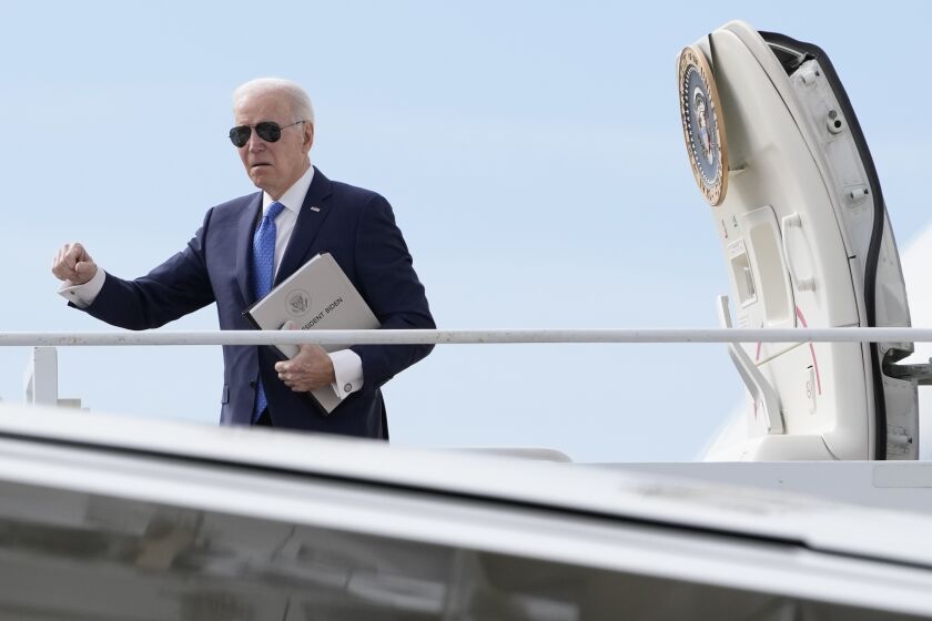 President Joe Biden boards Air Force One at Delaware Air National Guard Base in New Castle, Del., Monday, April 3, 2023, en route to Fridley, Minn. (AP Photo/Carolyn Kaster)