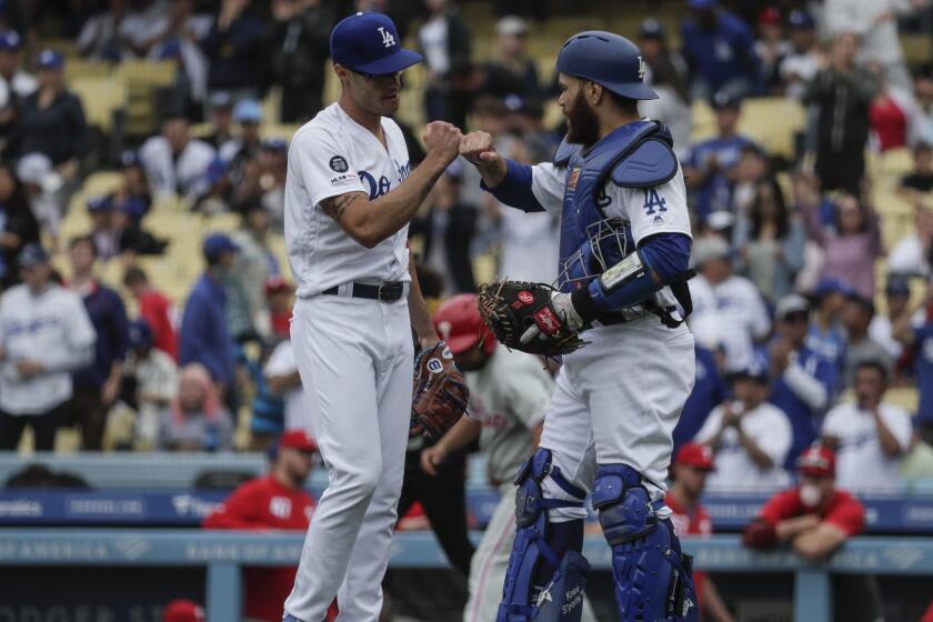LOS ANGELES, CA, SUNDAY, JUNE 2, 2019 - Dodgers catcher Russell Martin congratulates Joe Kelly after the reliever pitched a scoreless ninth inning against the Phillies at Dodger Stadium. (Robert Gauthier/Los Angeles Times)
